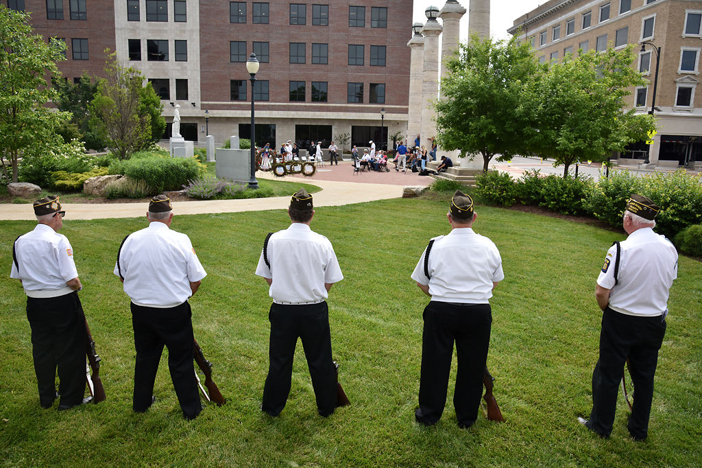 Vernon Gross, Frank Frevert, Ray Thames, Larry Schlueter and Neil Smith stand at attention